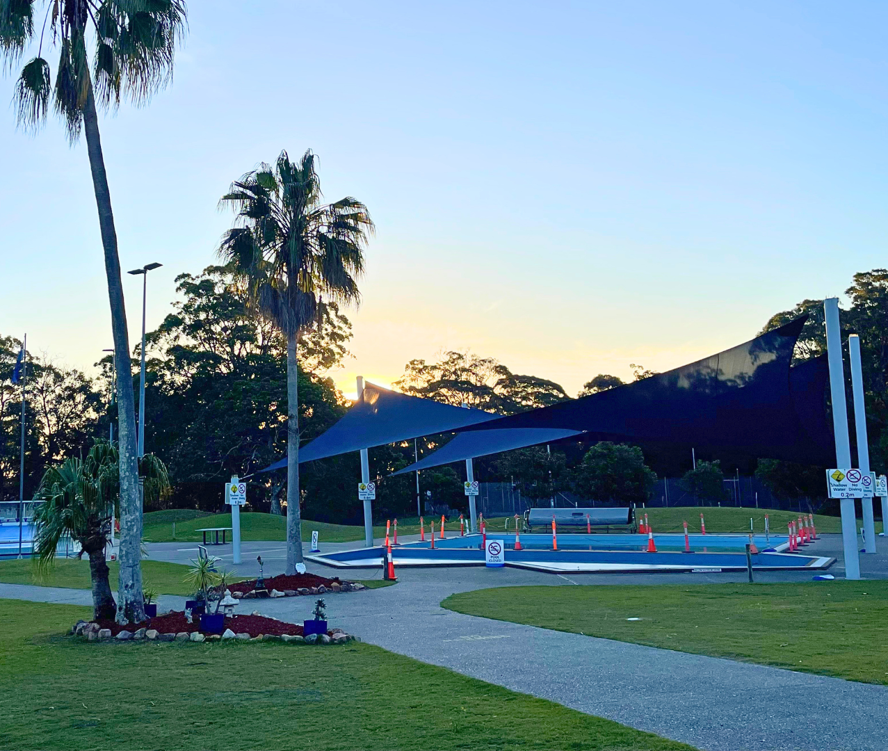 Featured is the shaded wading pool at Tomaree Aquatic Centre in the evening.