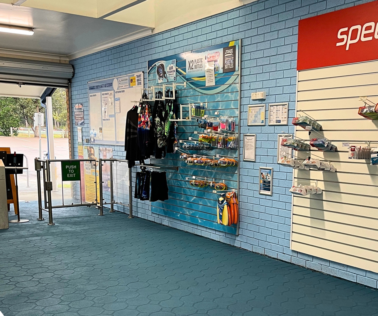 Tomaree Aquatic Centre Kiosk inside. Image shows the swim accessories on the wall that is sold in the Kiosk.